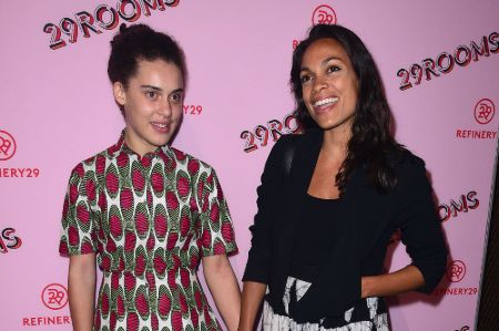 Rosario Dawson in a black dress with daughter, Lola.